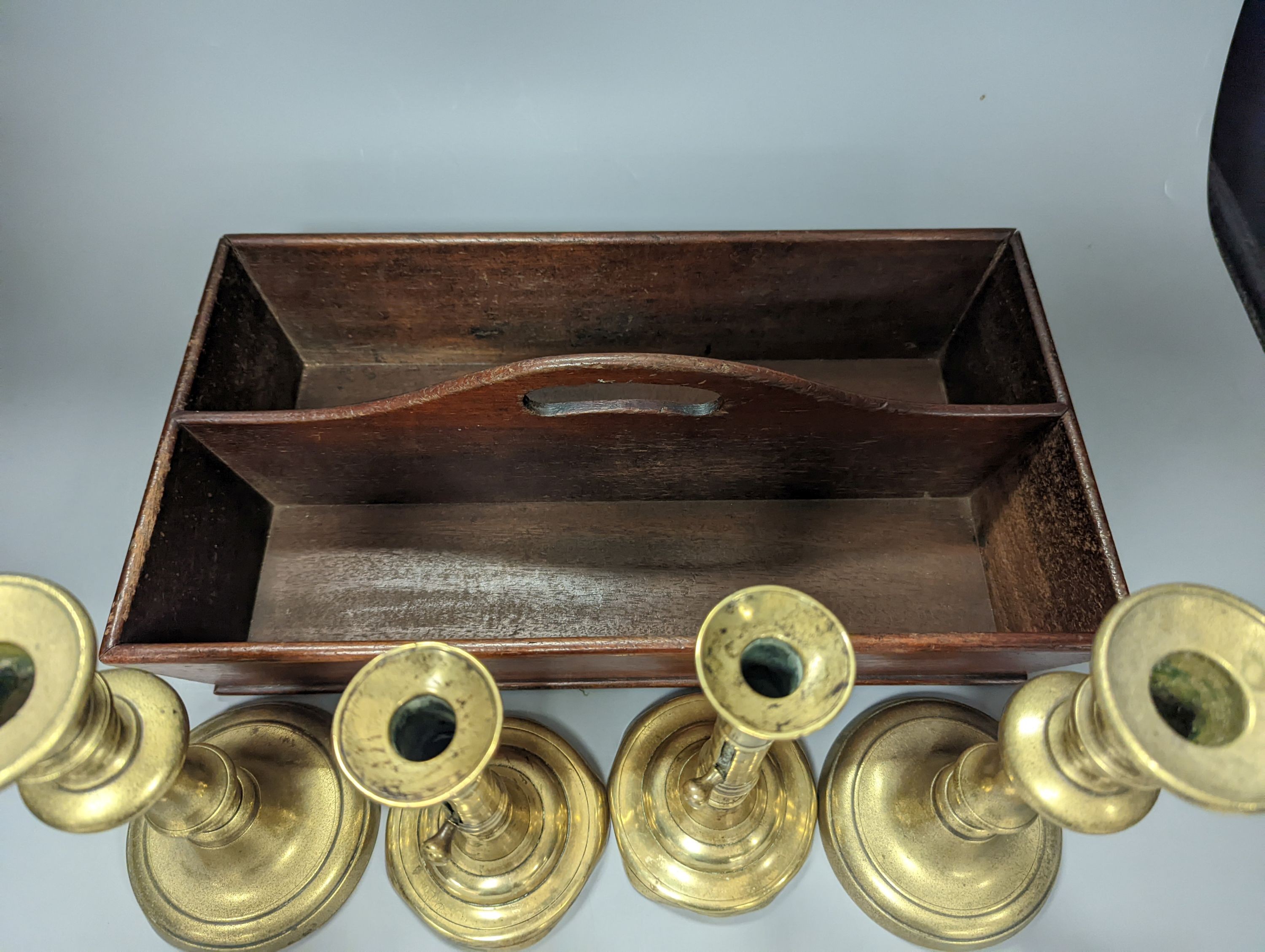 A pair of brass push-ejector candlesticks, a pair of Victorian brass candlesticks and a Victorian mahogany knife box, Knife box 38 cms wide.